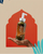 Close-up of Zulfé herbal hair oil held in hand against decorative background
